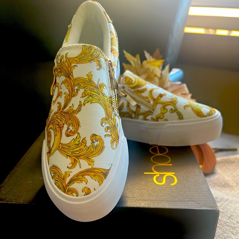 Shoe Dazzle platform type slip on gold and white shoe